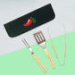 A flat lay of a grill set, with a black case with a bright red Chili's pepper with a green "'s" and a knife, fork, and tongs with "WHO'S HUNGRY FOR A DAD JOKE?" engraved on each handle.