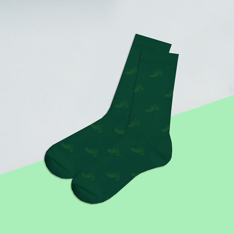 A pair of green socks with the Chili's logo patterned across them.